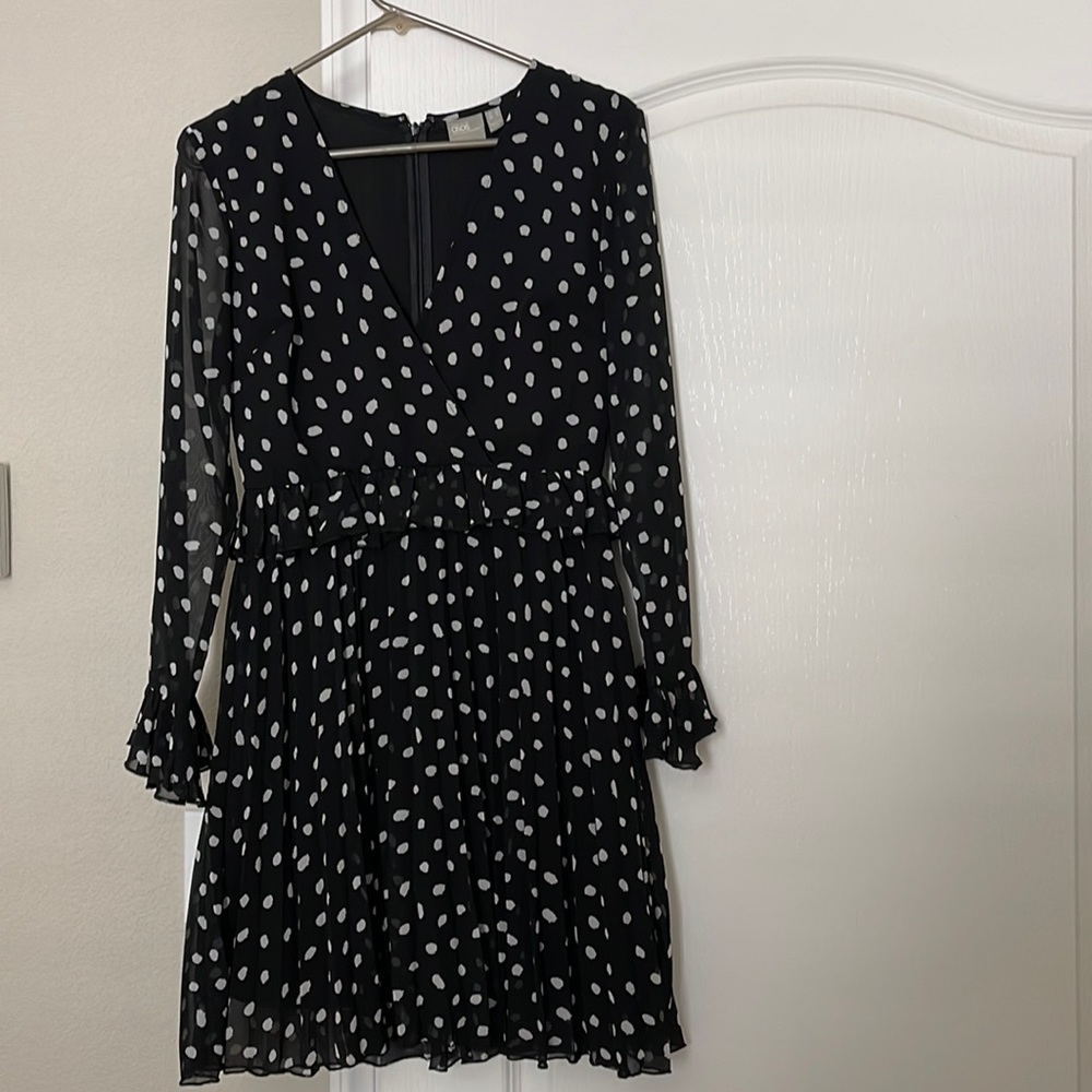 ASOS DESIGN black and white polka dot V-neck pleated midi dress.